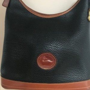 Dooney and Bourke Crescent Shape Black/Tan Leather Handbag